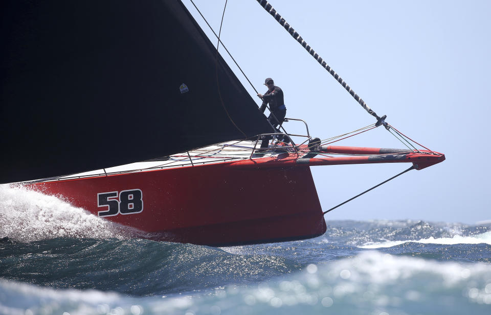 The bowman of Comanche directs his helmsman during the start of the Sydney Hobart yacht race in Sydney, Wednesday, Dec. 26, 2018. The 630-nautical mile race has 85 yachts starting in the race to the island state of Tasmania. (AP Photo/Rick Rycroft)