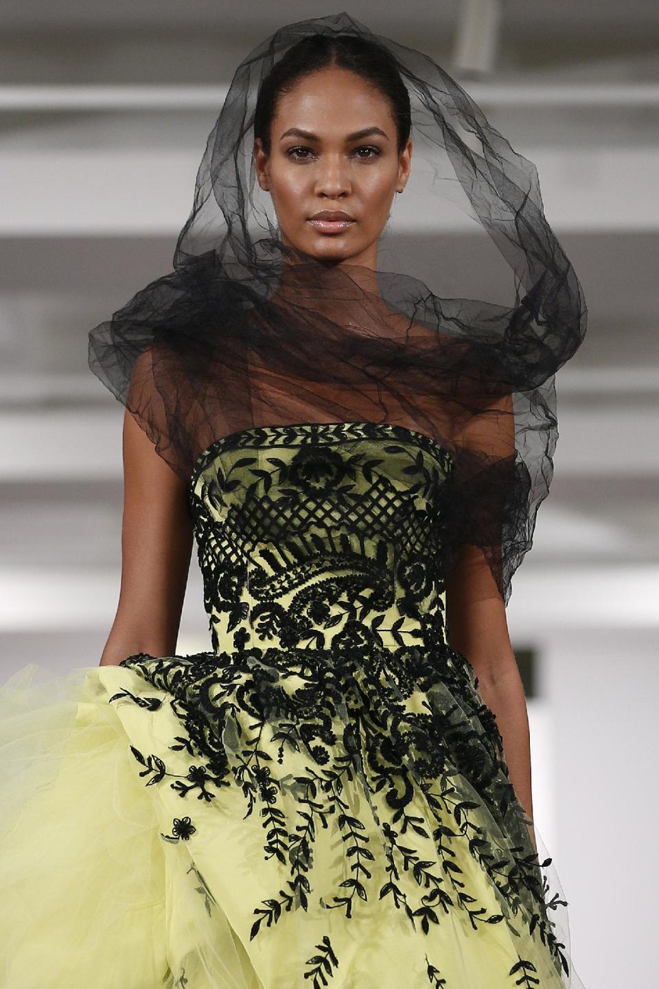 The Oscar de la Renta Spring 2014 collection is modeled during Fashion Week in New York, Tuesday, Sept. 10, 2013. (AP Photo/John Minchillo)