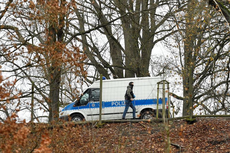 Police secure the area around the Waidmannsheil hunting lodge, in Saaldorf