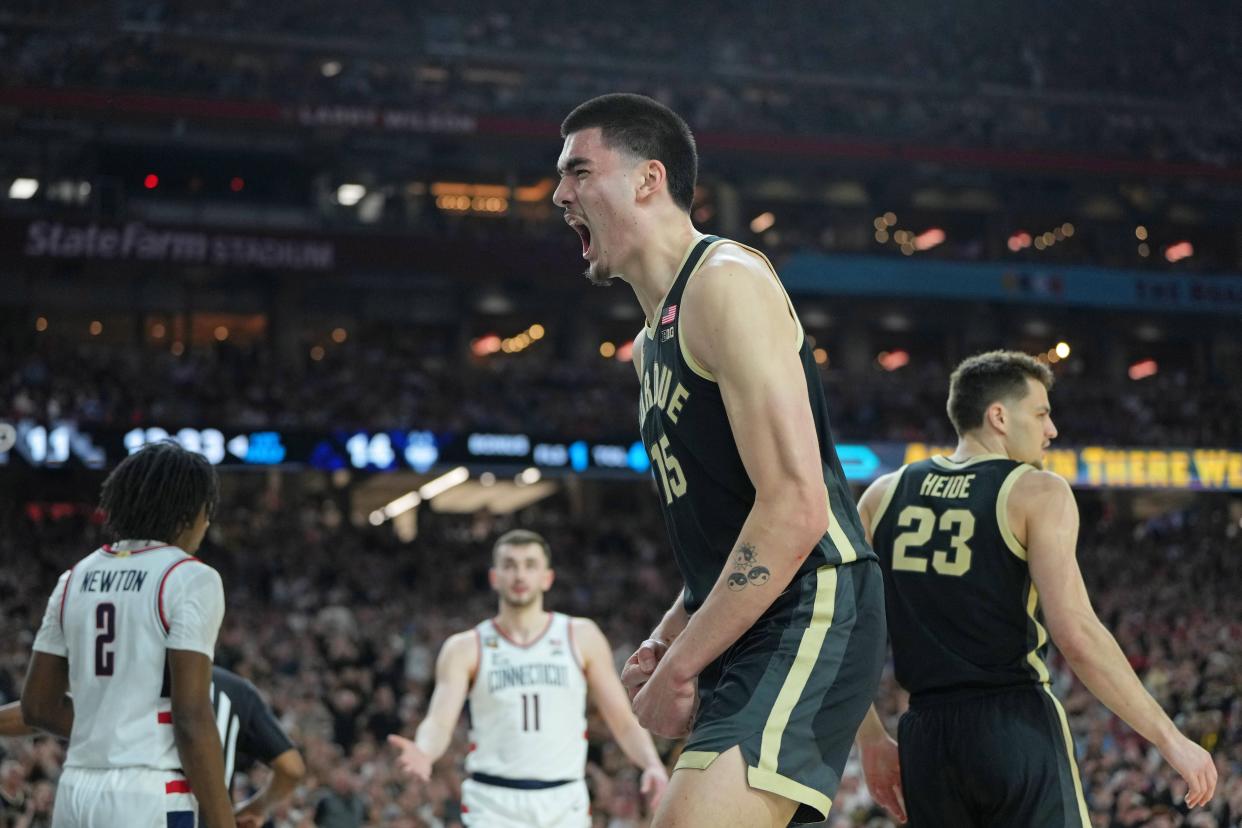 Purdue center Zach Edey (15) celebrates after blocking a shot against Connecticut during the first half of the 2024 men's national championship game at State Farm Stadium in Glendale, Arizona on April 8, 2024.