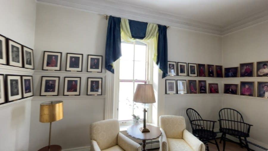 Portraits line the white walls of the Sweet House's Presidents' Room.