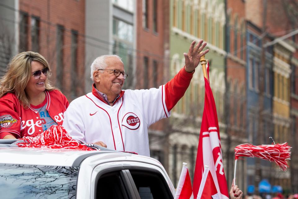 Hall of Fame announcer Marty Brennaman waves to fans while serving as the Grand Marshal for the canceled 2020 Findlay Market Opening Day Parade, in downtown Cincinnati on Tuesday, April 12, 2022. It was the first time the parade was held since 2019.