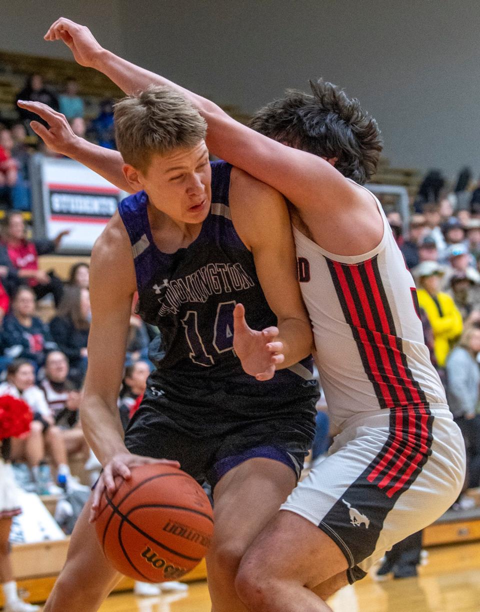 Bloomington South's Gavin Wisley (14) is guarded by Edgewood's Nick McCullough (34) during the Bloomington South versus Edgewood boys basketball game at Edgewood High School on Tuesday, Nov. 22, 2022.