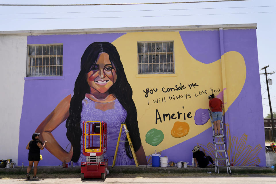 Artists work on a mural to honor Amerie Jo Garza, a student who was killed in the shootings at Robb Elementary school last month, Sunday, July 17, 2022, in Uvalde, Texas. The Texas House investigative committee released its full report on the shootings at Robb Elementary School Sunday. (AP Photo/Eric Gay)