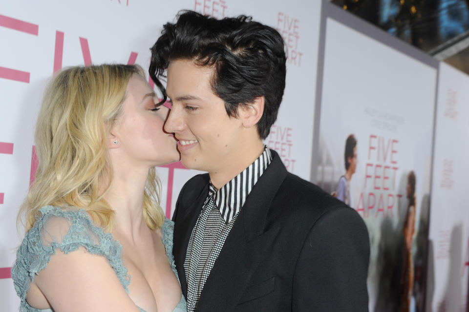 closeup of lili kissing cole's cheek