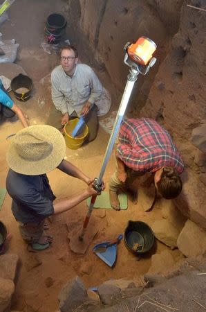 A supplied image showing scientists at work during excavations at the Madjedbebe site located in the Kakadu region in northern Australia June 29, 2015 which has revelead that humans reached the country at least 65,000 years ago - up to 18,000 years earlier than archaeologists previously thought. Dominic O'Brien-Gundjeihmi Aboriginal Corporation/Handout via REUTERS