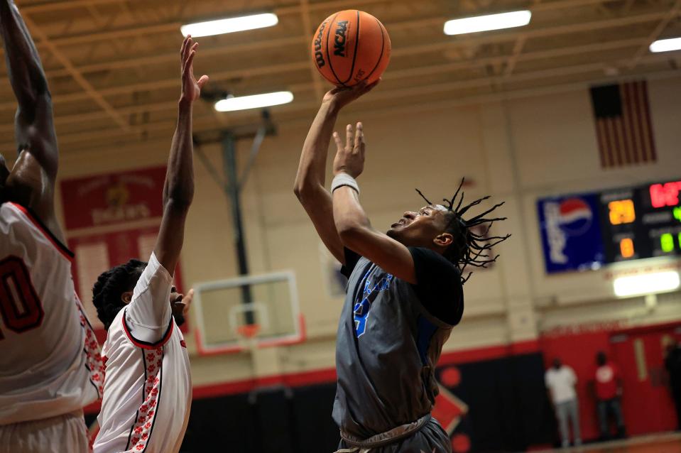 Ribault's Caleb Williams (3) shoots the ball against Jackson during the District 3-4A boys basketball final. The senior guard leads Northeast Florida in scoring for 2023-24.