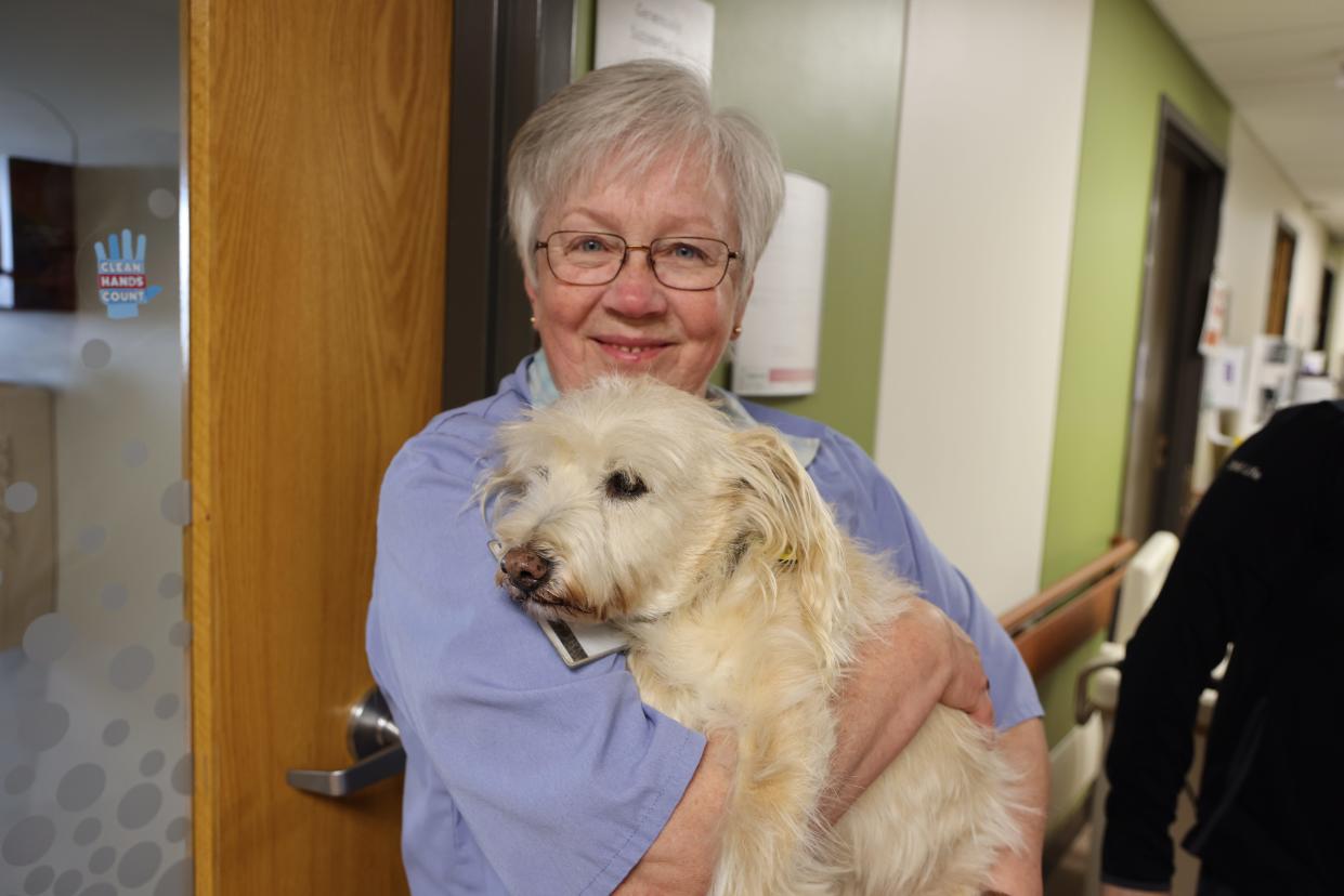 Eddie, who served 13 years at Sparrow Hospital as a therapy dog, and his owner Jennifer Good are seen in this undated photo.