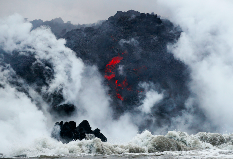Lava flows into the ocean near Pahoa in May after the Kilauea volcano erupted (Picture: PA)