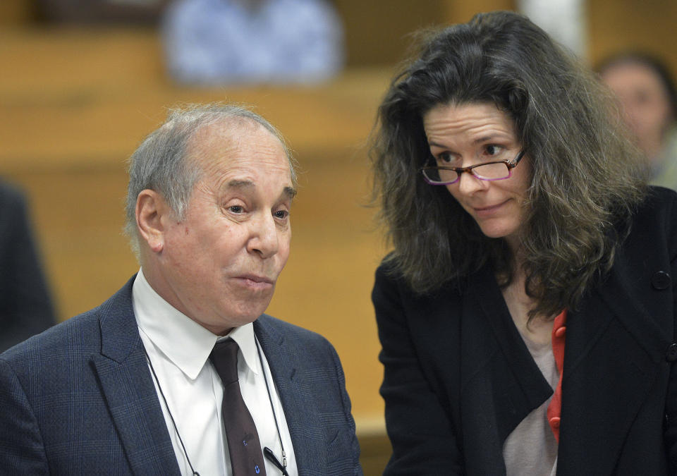 FILE - In this Monday April 28, 2014, file photo, Singer Paul Simon, left, and his wife Edie Brickell appear at a hearing in Norwalk Superior Court in Norwalk, Conn. Paul Simon performed a rousing set and accepted an award from New York University in his first public appearance since he and wife Edie Brickell were arrested on disorderly conduct charges, on Wednesday, May 7, 2014. (AP Photo/The Hour, Alex von Kleydorff, Pool, File)