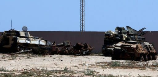 Destroyed Libyan tanks which the government said were targeted by the NATO-led coalition are pictured in Janzur, west of Tripoli, on June 13. Rebels said they suffered heavy losses in eastern Libya after being "tricked" by Moamer Khadafi's forces, as the US pressed Africa to take tougher action against the strongman's regime