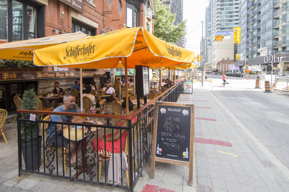TORONTO, July 18, 2020 -- People dine on the patio of a restaurant in Toronto, Canada, on July 18, 2020. The City of Toronto launched a program called &quot;CafeTO&quot; in July to allow restaurants and bars to expand their patio space to safely serve more customers during the COVID-19 pandemic. (Photo by Zou Zheng/Xinhua via Getty) (Xinhua/Zou Zheng via Getty Images)