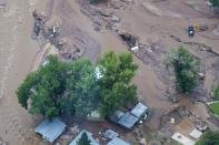 An aerial photo of a flood-affected area of northern Colorado along the Big Thompson River which has been declared a federal disaster area is shown in this September 14, 2013 handout photo provided by the U.S. Air National Guard September 15, 2013. Colorado authorities warned that the death toll likely would rise from historic flooding in the state as a second person was confirmed missing and presumed dead, in addition to fourth deaths previously verified. Photo taken September 14, 2013. REUTERS/Capt. Darin Overstreet/U.S. Air National Guard/Handout via Reuters (UNITED STATES - Tags: ENVIRONMENT DISASTER) ATTENTION EDITORS - THIS IMAGE WAS PROVIDED BY A THIRD PARTY. FOR EDITORIAL USE ONLY. NOT FOR SALE FOR MARKETING OR ADVERTISING CAMPAIGNS. THIS PICTURE IS DISTRIBUTED EXACTLY AS RECEIVED BY REUTERS, AS A SERVICE TO CLIENTS