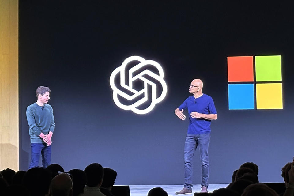 FILE - OpenAI CEO Sam Altman, left, appears onstage with Microsoft CEO Satya Nadella at OpenAI's first developer conference, on Nov. 6, 2023, in San Francisco. Nadella marks his tenth year as Microsoft CEO on Sunday, Feb. 4, 2024, capping a decade of stunning growth as he pivoted the slow-moving software giant into a laser focus on cloud computing and artificial intelligence. (AP Photo/Barbara Ortutay, File)