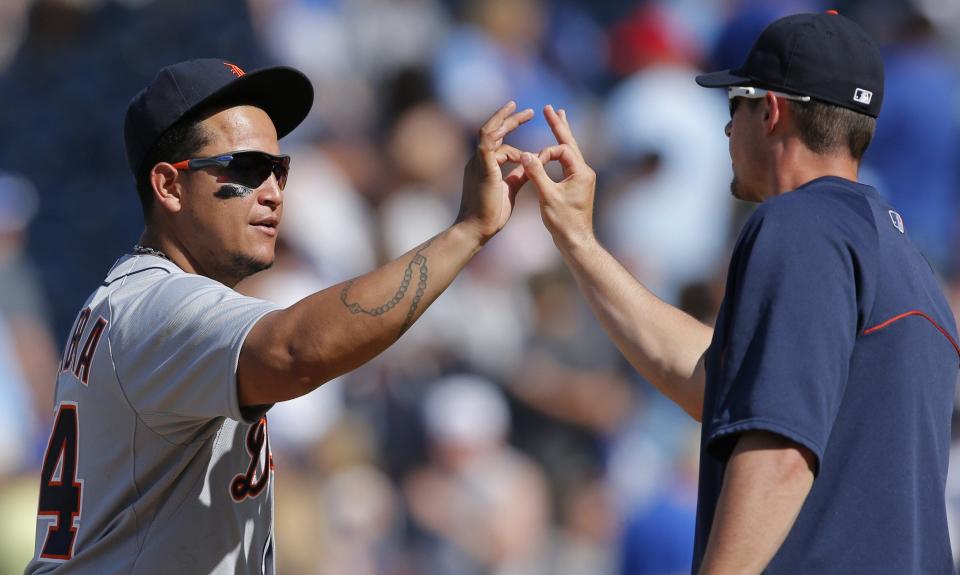 Tigers first baseman Miguel Cabrera, left, celebrates with teammate Don Kelly, right, following a game in 2014.