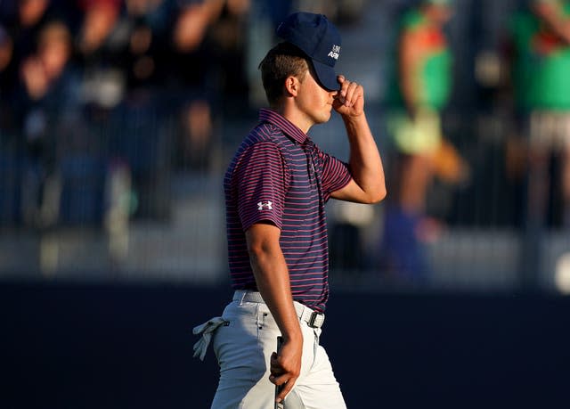 Jordan Spieth pulls his cap down over his eyes  