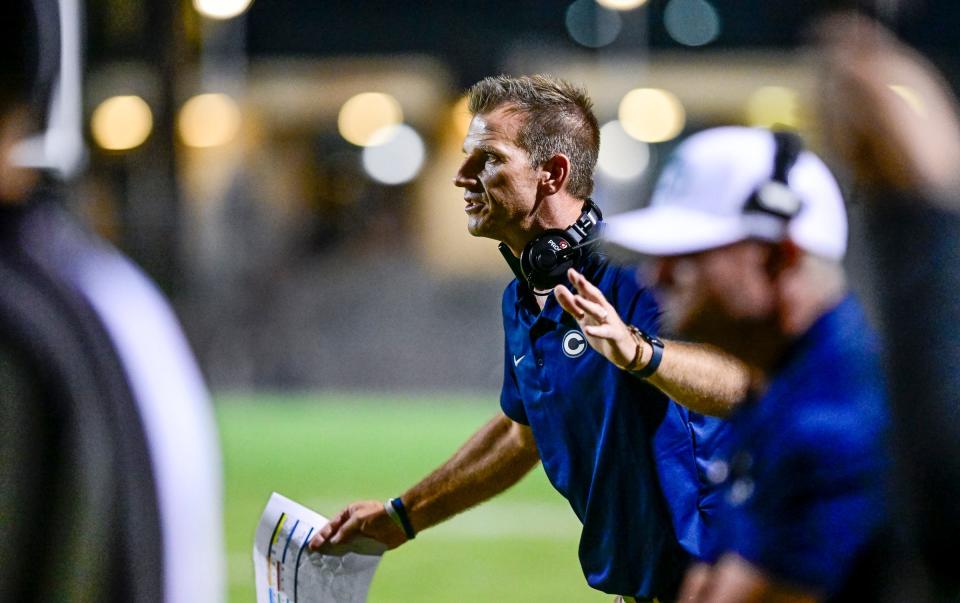 Central Valley Christian's Head Coach Mason Hughes at the sideline during a non-league game against Mt. Whitney on Friday, August 26, 2022. 