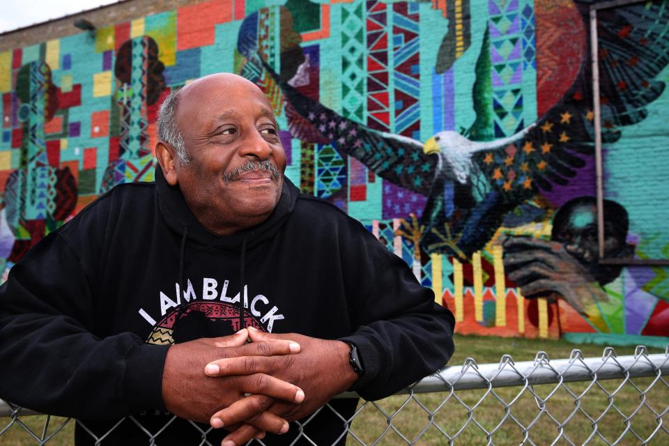 Clayborn Benson, the founder of the Wisconsin Black Historical Society, stands outside the museum in front of the mural that was painted by artist George Gist in 2016.