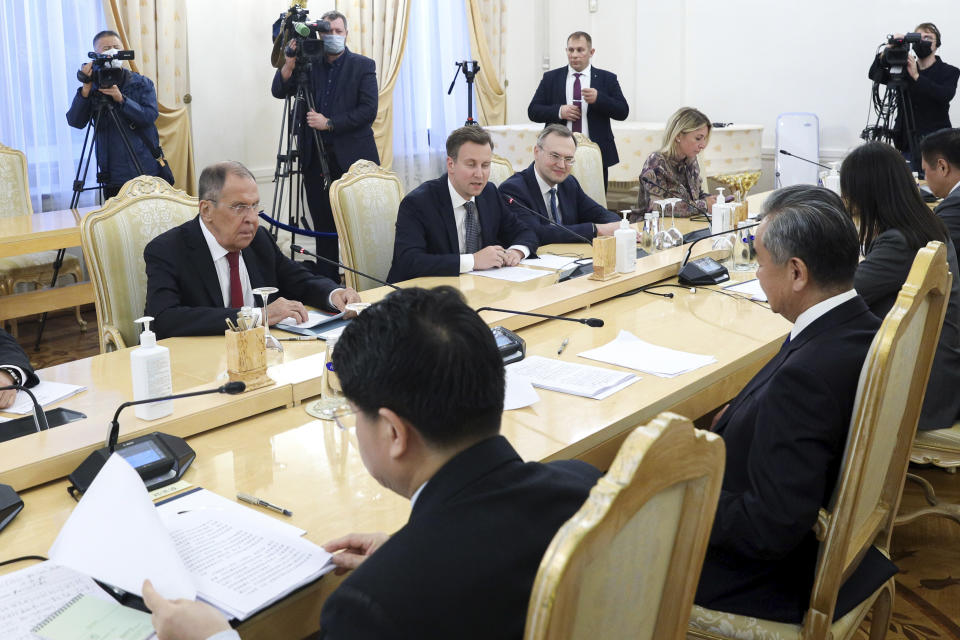 In this photo released by Russian Foreign Ministry Press Service, Russian Foreign Minister Sergey Lavrov, left, speaks with Chinese Foreign Minister Wang Yi during their talks in Moscow, Russia, Monday, Sept. 18, 2023. (Russian Foreign Ministry Press Service via AP)