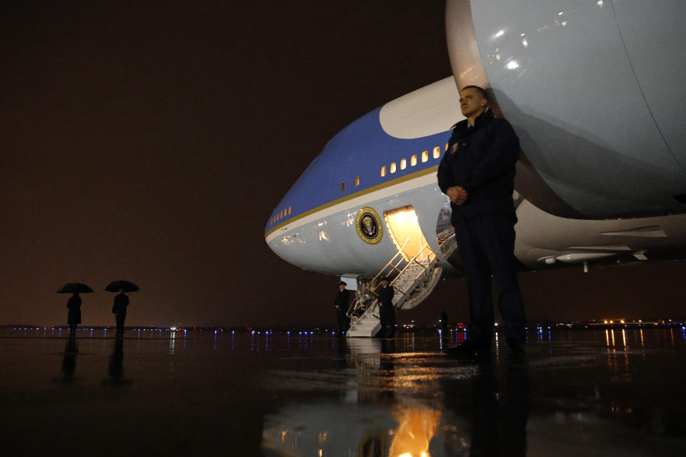 Personnel wait outside for President Donald Trump's arrival at Air Force One at Andrews Air Force Base, Md., Tuesday, Dec. 10, 2019, en route to a campaign rally in Hershey, Pa. (AP Photo/Patrick Semansky)