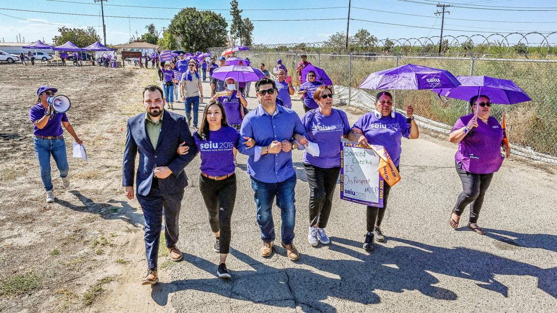 Local leaders including Fresno City Councilmember Luis Chavez and councilmember-elect Annalisa Perea join nursing home workers and other labor group representatives in marching toward the offices of the Sunnyside Convalescent Hospital during a one-day strike on Wednesday, Sept. 21, 2022. The workers handed off a notice to management saying they would go on an indefinite strike starting next month unless their employer would come to the table to bargain over the issues they are brining up.