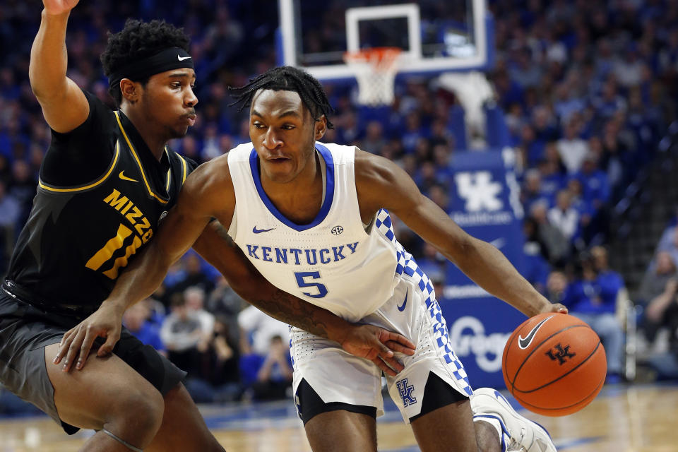 Kentucky's Immanuel Quickley (5) drives on Missouri's Mario McKinney Jr. (11) during the second half of an NCAA college basketball game in Lexington, Ky., Saturday, Jan 4, 2020. Kentucky won 71-59. (AP Photo/James Crisp)