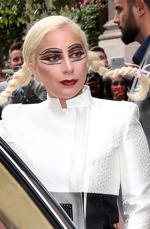 Always one to make a grand entrance, Lady Gaga debuted an interesting look at the Langham Hotel in London, reminiscent of a Pippi Longstocking Halloween costume. The Poker Face signer combined dramatically lined eyes, with liquid liner applied above and below her eyelids, with peroxide blonde braids. A little less crazy but just as striking were her sparkly pink lids, Russian red lips and expertly bronzed cheeks.