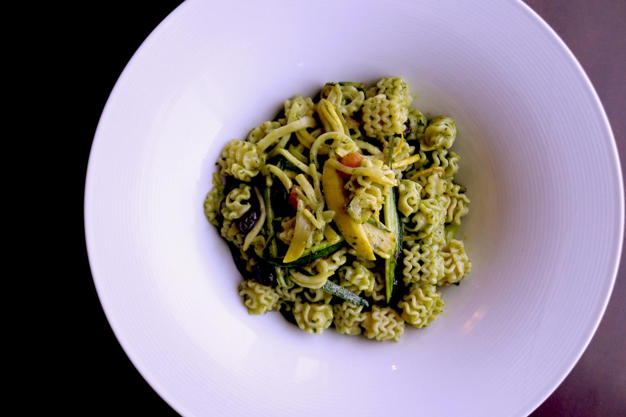 The pasta Julia at Django features radiatori, tomato, olive, julienned vegetables, and herb pistou.