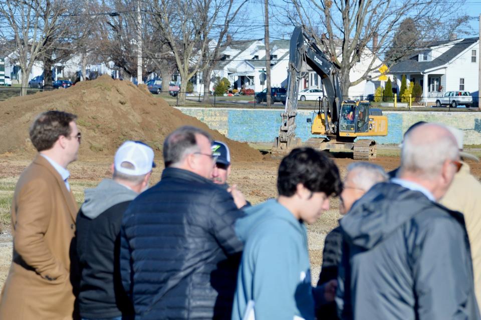 Construction continues at the site of the Hagerstown Field House on Tuesday while about 100 people attend a groundbreaking for the indoor sports facility.