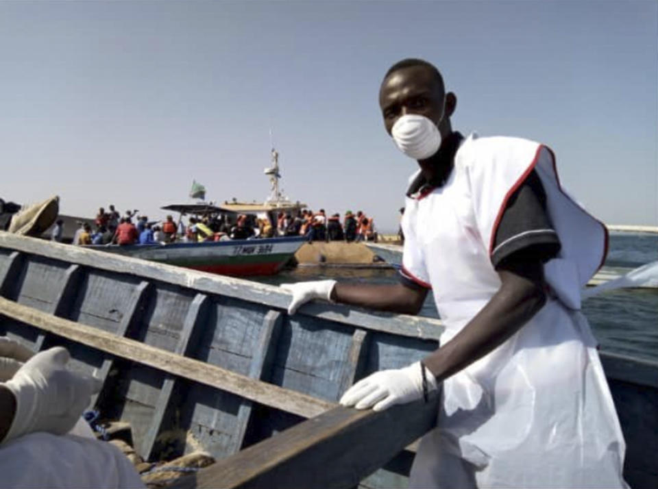 This photo released by the Tanzania Red Cross shows Red Cross volunteers engaged in rescue efforts on and around Ukara Island in Lake Victoria, Tanzania Friday, Sept. 21, 2018. The death toll rose above 100 on Friday after the passenger ferry MV Nyerere capsized and sank on Thursday in Lake Victoria, Tanzania state radio reported. (Tanzania Red Cross via AP)