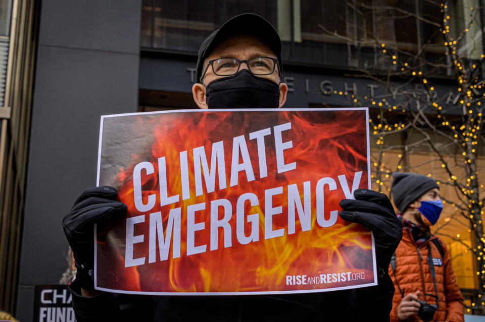 MANHATTAN, NEW YORK, UNITED STATES - 2021/03/03: Participant seen holding a sign at the protest. Climate activists with Stop the Money Pipeline held a rally in midtown Manhattan first at BlackRocks HQ and then march to JP Morgan Chase HQ, -two of the worlds biggest funders of climate destruction in their opinion- to urge the two companies to end their support for the dangerous proposed Line 3 pipeline project, and stop funding fossil fuels and forest destruction. (Photo by Erik McGregor/LightRocket via Getty Images)