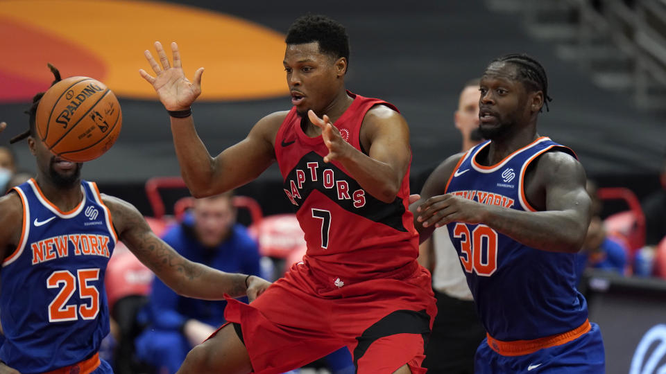 Toronto Raptors guard Kyle Lowry (7) waits for a pass in front of New York Knicks forward Julius Randle (30) during the second half of an NBA basketball game Thursday, Dec. 31, 2020, in Tampa, Fla. (AP Photo/Chris O'Meara)