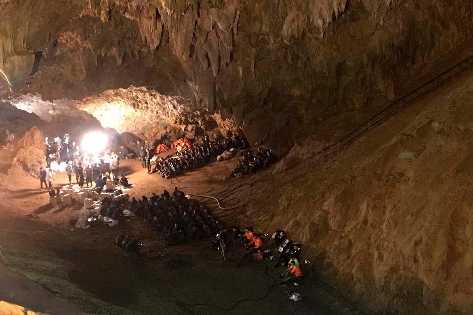 Emergency rescue teams gather in the staging area searching for the young soccer team and their coach while they were missing in a large cave in Mae Sai, Chiang Rai province, northern Thailand on  June 26, 2018.