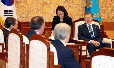 South Korean President Moon Jae-in talks with delegation of the Olympic Athletes from Russia during their meeting at the Presidential Blue House in Seoul, South Korea, February 20, 2018. Yonhap/via REUTERS