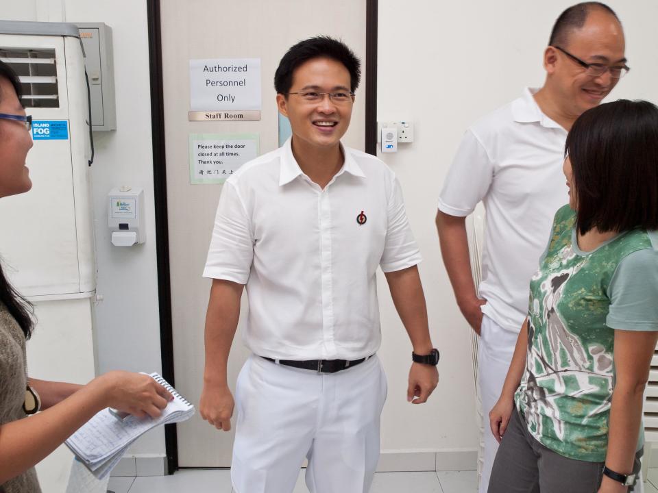 Despite the morning heat and a nearly three-hour parade, Desmond Choo remained upbeat and was all-smiles to reporters. (Yahoo! photo/Alvin Ho)