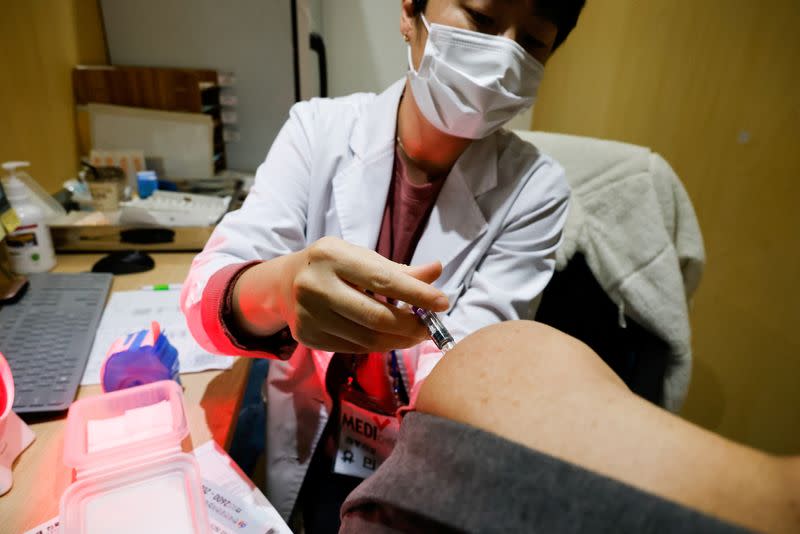 A man gets an influenza vaccine at a branch of the Korea Association of Health Promotion in Seoul