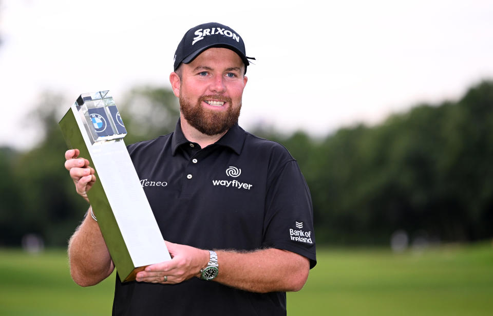 Seen here, Ireland's Shane Lowry celebrates with the winner's trophy after the final round of the BMW PGA Championship at Wentworth Golf Club. 