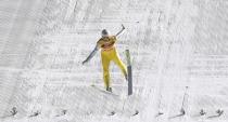 Ski Jumping - 65th four-hills ski jumping tournament final round - Bischofshofen, Austria - 06/01/2017 - Norway's Daniel Andre Tande struggles during his final jump. REUTERS/Dominic Ebenbichler