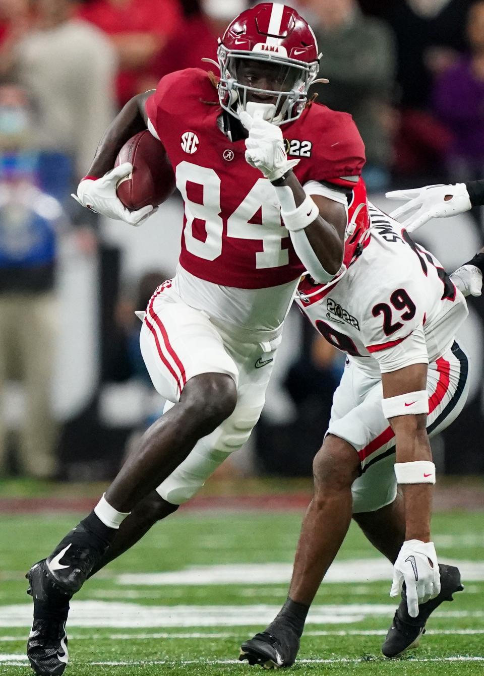 Jan 10, 2022; Indianapolis, IN, USA; Alabama wide receiver Agiye Hall (84) carries the ball against Georgia during the 2022 CFP college football national championship game at Lucas Oil Stadium.