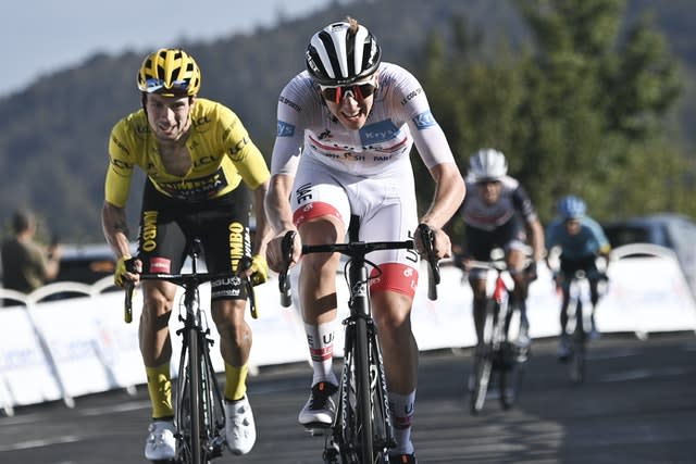 Slovenia’s Tadej Pogacar, right, edges out fellow Slovenian and yellow jersey holder Primoz Roglic in a sprint finish at the end of stage 15 at the Tour de France