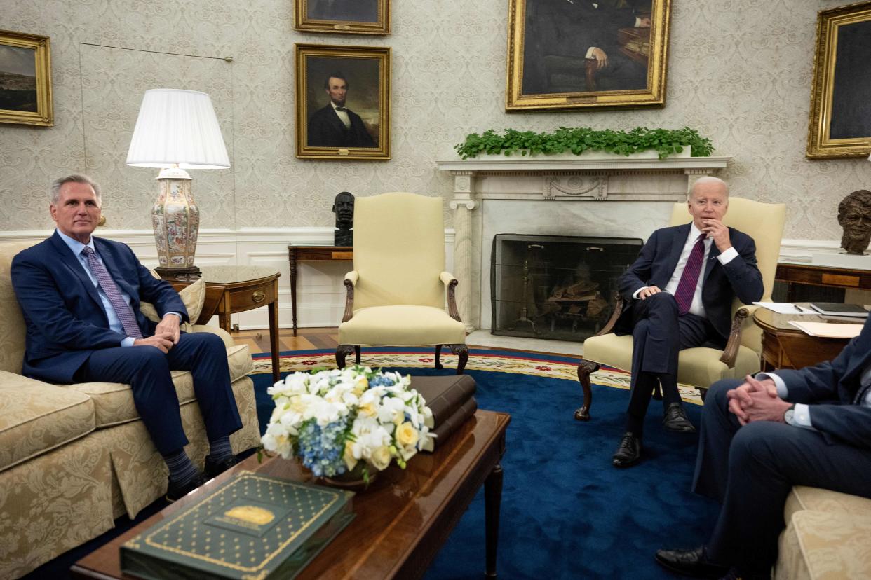 Speaker of the House Kevin McCarthy (R-CA) and US President Joe Biden wait for a meeting about the United States's debt ceiling in the Oval Office of the White House May 9, 2023, in Washington, DC. Biden and Republican leaders met in hopes of breaking an impasse over the US debt limit. The lifting of the national debt ceiling  allows the government to pay for spending already incurred. (Photo by Brendan Smialowski / AFP) (Photo by BRENDAN SMIALOWSKI/AFP via Getty Images)