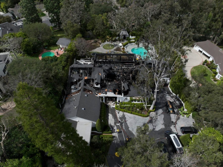 An aerial view shows a fire-damaged property, which appears to belong to Cara Delevingne, Friday, March 15, 2024, in the Studio City section of Los Angeles. (AP Photo/Jae C. Hong)