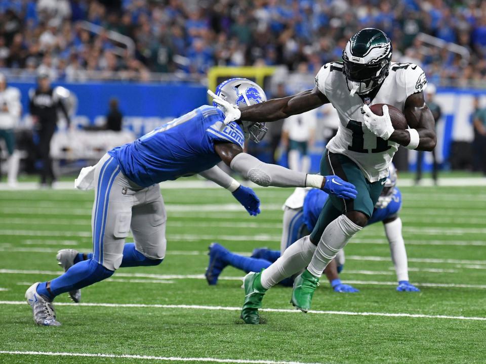 A.J. Brown evades a tackle by the Detroit Lions defense.