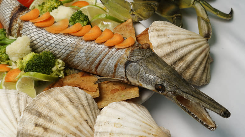 Tropical gar on plate with vegetables