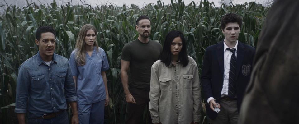 Theo Rossi (far left), Jordan Claire Robbins, Shane West, Elena Juatco and Julian Feder star as strangers who wake up in a mysterious corn maze full of danger in the survival horror film "Escape the Field."