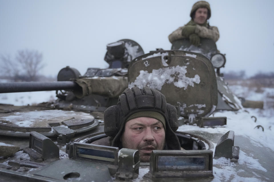 Ukrainian's drive in an armored personnel carrier near front line position in the Luhansk area, in eastern Ukraine, Friday, Jan. 28, 2022. With more than 100,000 Russian troops positioned around Ukraine, Russian President Vladimir Putin appears to be preparing to launch an invasion. Certainly, the U.S. believes that's the case and President Joe Biden has warned the Ukrainian president that an attack could come in February. But Russia has other options it could pursue short of a full-blown invasion (AP Photo/Vadim Ghirda)