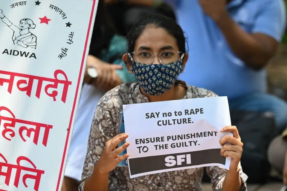 File: Activists of Student Federation of India (SFI) and All India Democratic Women’s Association (AIDWA) hold placards during a protest against rape in India  (AFP via Getty Images)
