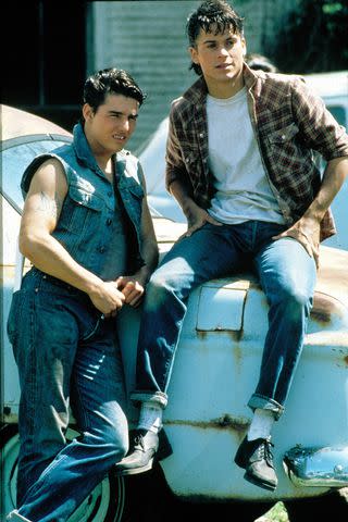 Moviestore/Shutterstock Tom Cruise and Rob Lowe in 1983's The Outsiders