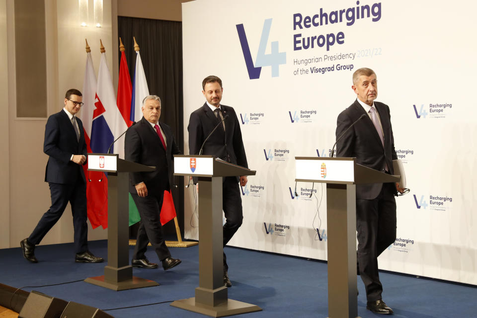 From left: Prime Ministers Mateusz Morawiecki of Poland, Viktor Orban of Hungary, Eduard Heger of Slovakia and Andrej Babis of the Czech Republic arrive for a news briefing in Budapest, Hungary, Tuesday, Nov. 23, 2021. The leaders of the Visegrad Four group of Central European countries met in Hungary's capital of Budapest Tuesday to discuss the ongoing migration crisis along Poland's border with Belarus. (AP Photo/Laszlo Balogh)