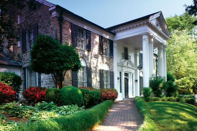 <p>GAB Archive/Redferns</p> Exterior view of Graceland